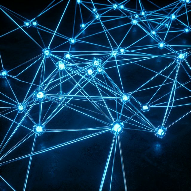 Abstract visualization of digital data networks and technology nodes glowing blue on a dark background